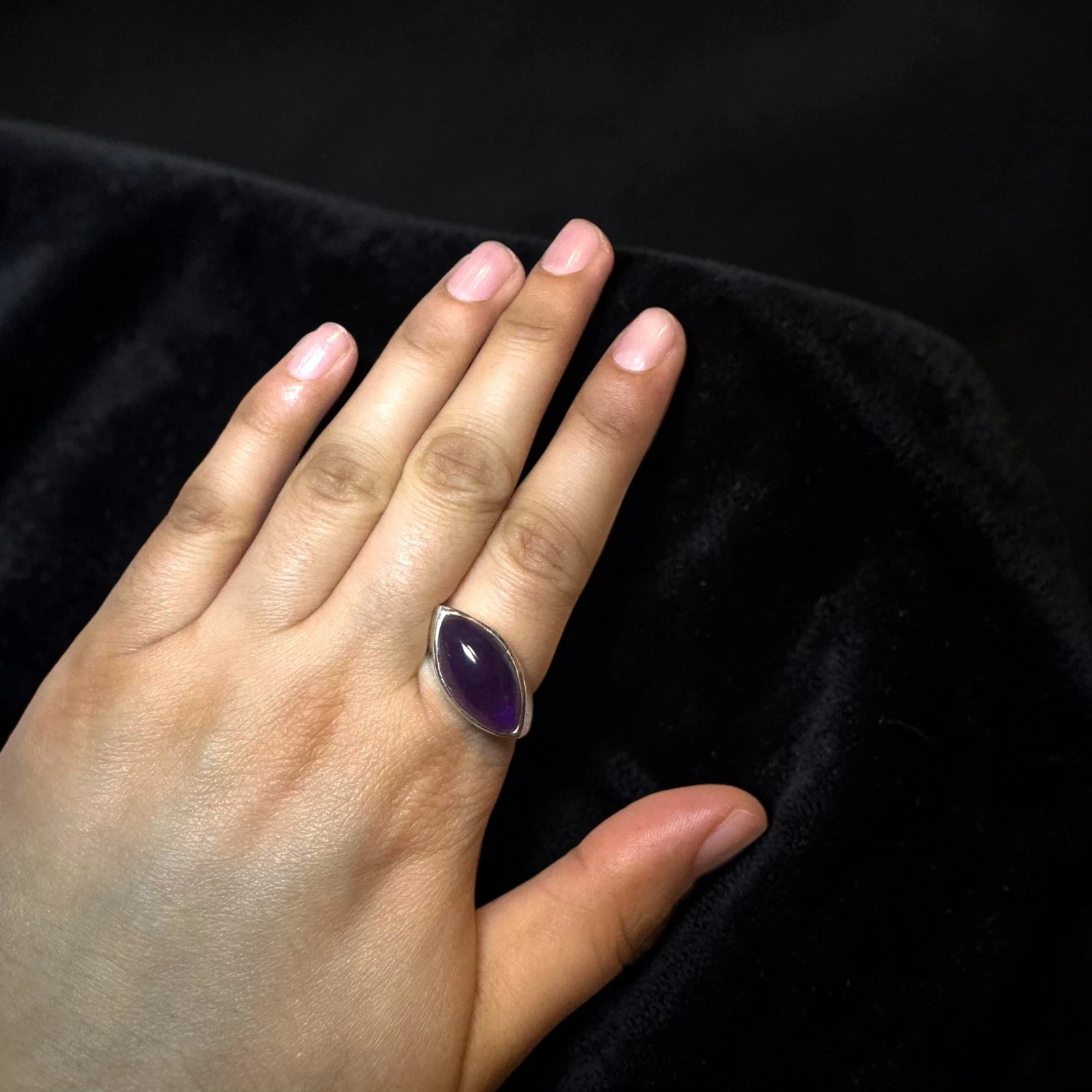 oval cabochon dark purple stone