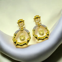 Bamboo Hoop Earrings with Lock Charm – Luxury Statement Jewelry